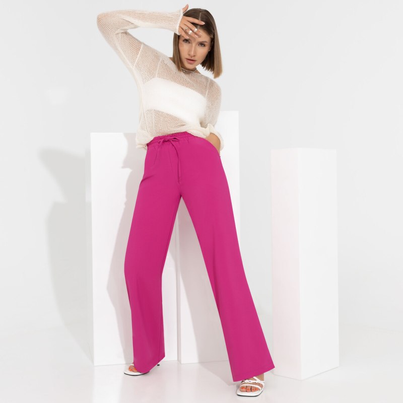 Розовые брюки фуксия