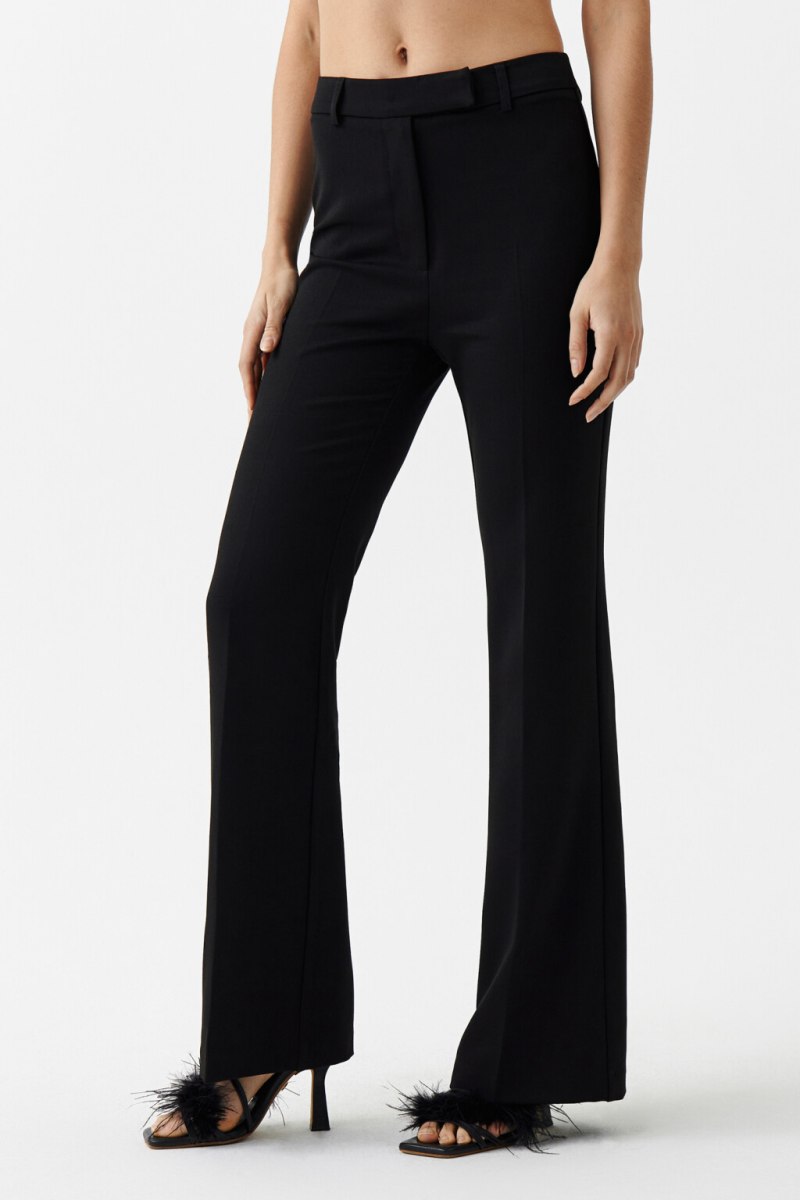 Брюки расклешенные от колена