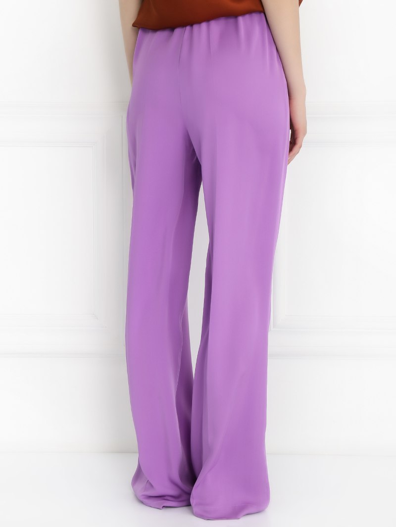 Сиреневые брюки женские