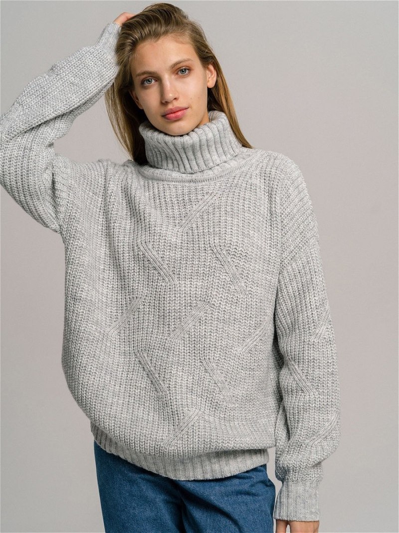 Шерстяной пуловер женский